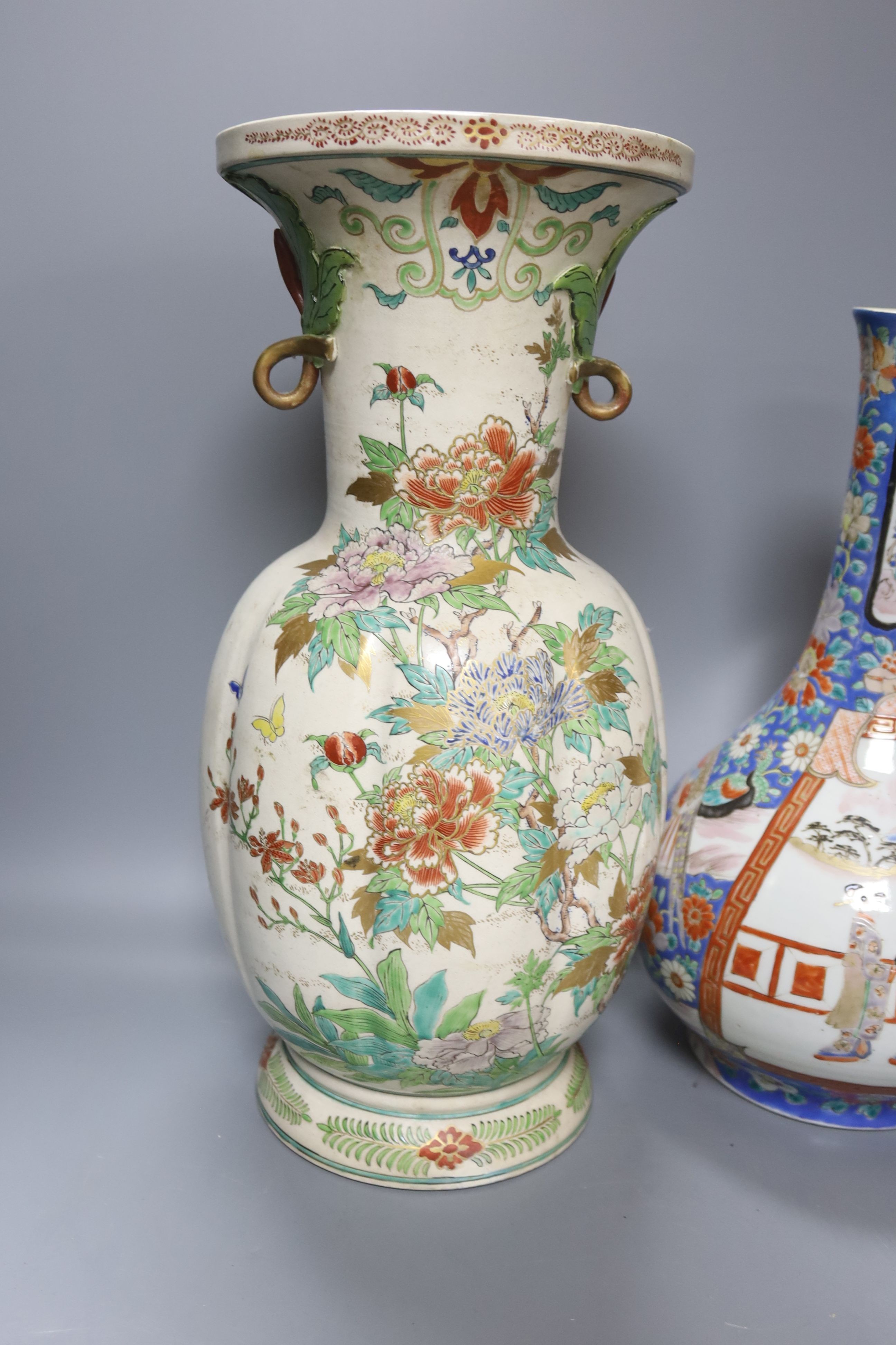 A Japanese porcelain bottle vase and a large Satsuma pottery vase (restoration) 39cm (2)